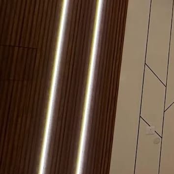 Fluted timber panel with a vertical LED light line