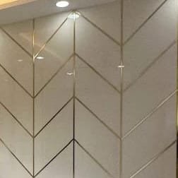 Herringbone wall panel with fine metal inlays
